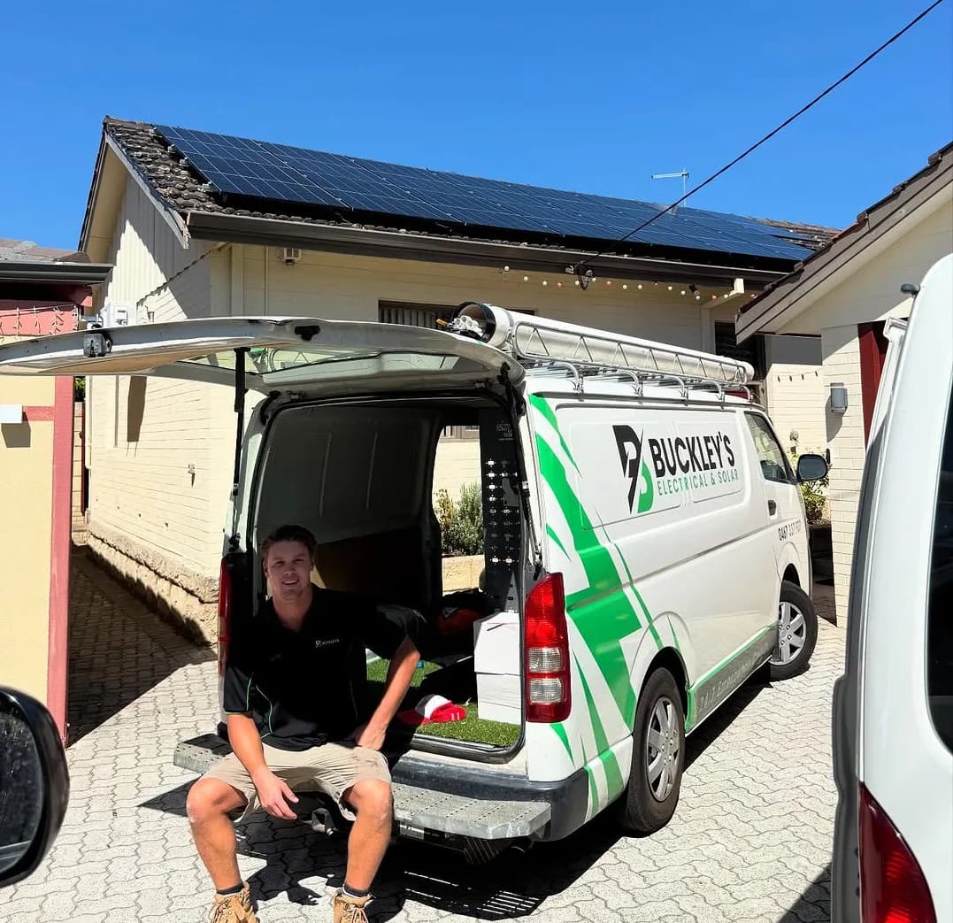 Buckley's Electrical & Solar team member after completing a rooftop solar panel installation in Perth